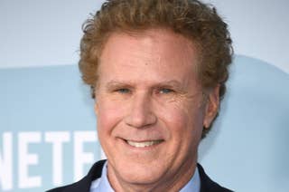 Will Ferrell at a public event, smiling while dressed in a suit and tie with a patterned pocket square